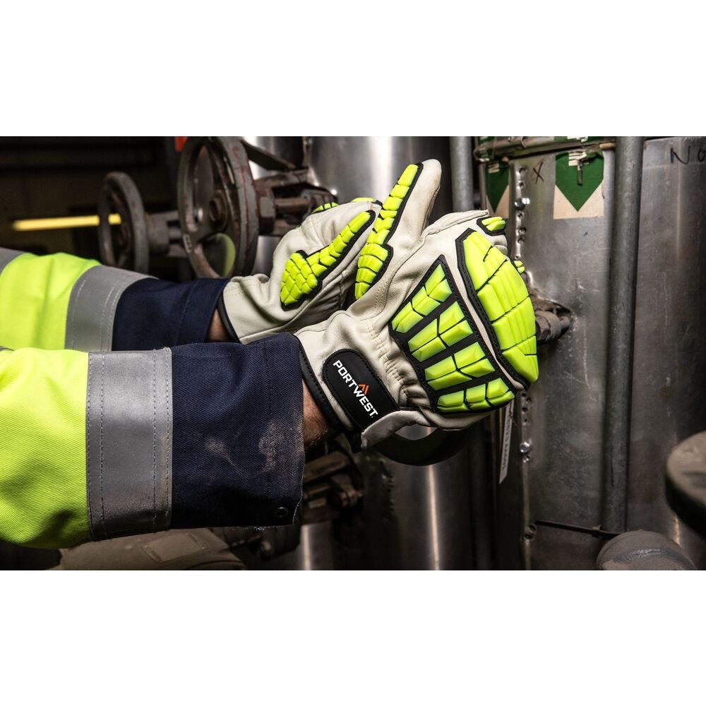A pair of black cut-resistant gloves with a blue rubber impact guard over the knuckles and a textured palm for grip