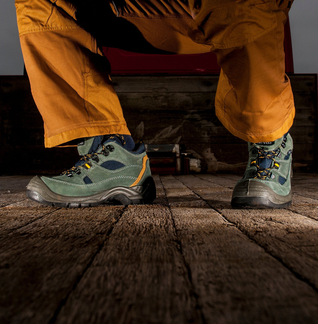 Black electrical hazard safety boots with non-conductive leather and rubber outsole, featuring an EH rating tag on the tongue